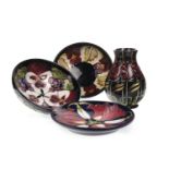 A MOORCROFT 'NIGHT ROSE' VASE, A PLATE AND TWO BOWLS