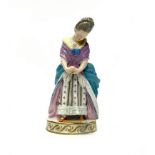 A MEISSEN FIGURE OF A FEMALE