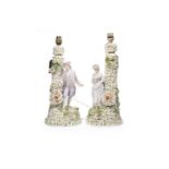 A PAIR OF VICTORIAN CERAMIC FIGURAL LAMP BASES
