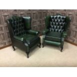 A PAIR OF GREEN LEATHER WING BACK ARMCHAIRS