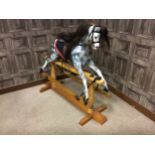 A DAPPLED GREY ROCKING HORSE