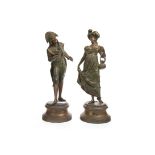 A PAIR OF SPELTER FIGURES AND ANOTHER