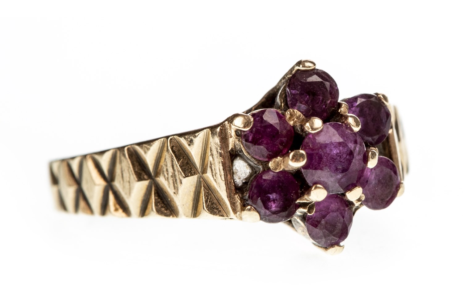 A PURPLE GEM SET FLORAL CLUSTER RING