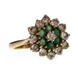 A GREEN AND WHITE GEM SET CLUSTER RING