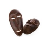 A PAIR OF AFRICAN CARVED WOOD MASKS