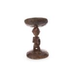 AN AFRICAN CARVED WOOD STOOL