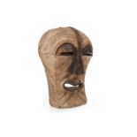 A LARGE AFRICAN CARVED WOOD MASK