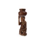 AN AFRICAN CARVED WOOD FIGURE