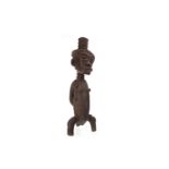 AN AFRICAN CARVED WOOD FIGURE