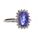 A TANZANITE AND DIAMOND CLUSTER RING