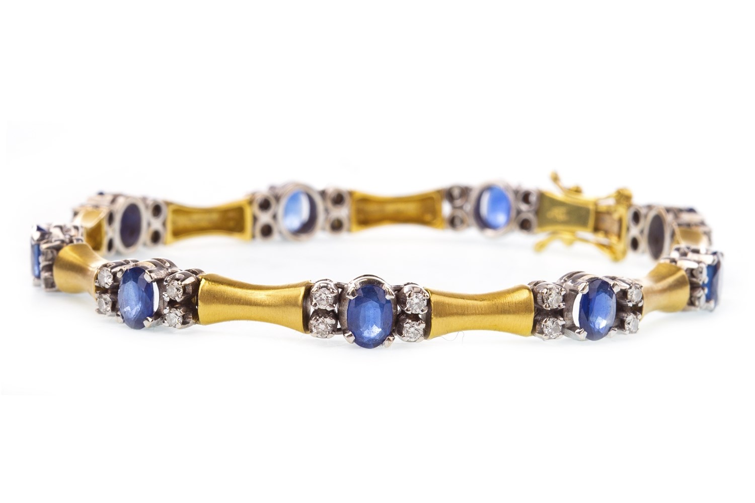 A BLUE GEM SET AND DIAMOND BRACELET