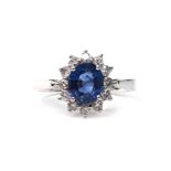 A SAPPHIRE AND DIAMOND CLUSTER RING