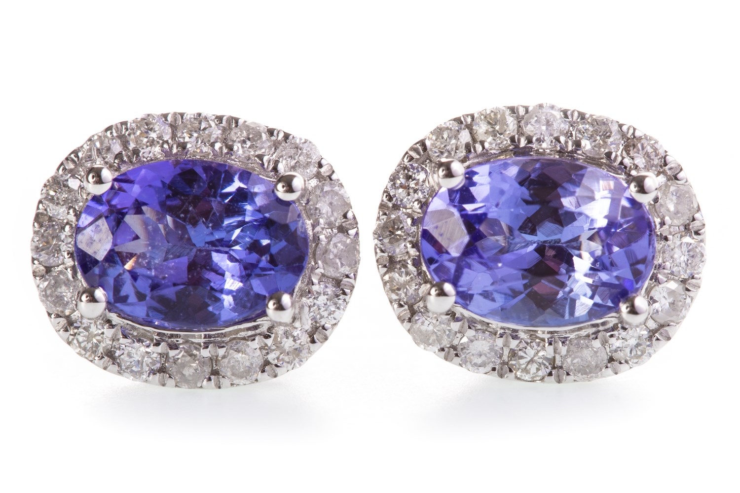 A PAIR OF TANZANITE AND DIAMOND STUD EARRINGS