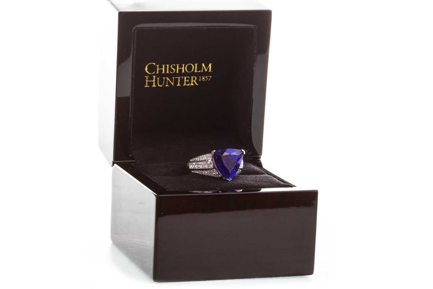 A PURPLE GEM AND DIAMOND RING