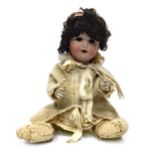 AN EARLY 20TH CENTURY GERMAN BISQUE HEADED DOLL