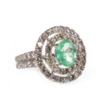 A CERTIFICATED COLOMBIAN EMERALD AND DIAMOND CLUSTER RING