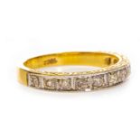 AN EARLY TO MID TWENTIETH CENTURY DIAMOND HALF ETERNITY RING