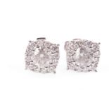 A PAIR OF DIAMOND CLUSTER EARRINGS