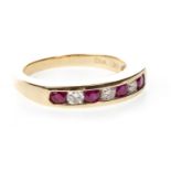 A RUBY AND DIAMOND HALF ETERNITY RING