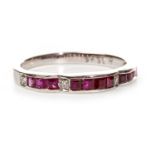 A RED GEM AND DIAMOND HALF ETERNITY RING