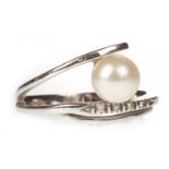 A PEARL AND DIAMOND SET RING