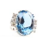 A BLUE TOPAZ AND DIAMOND RING