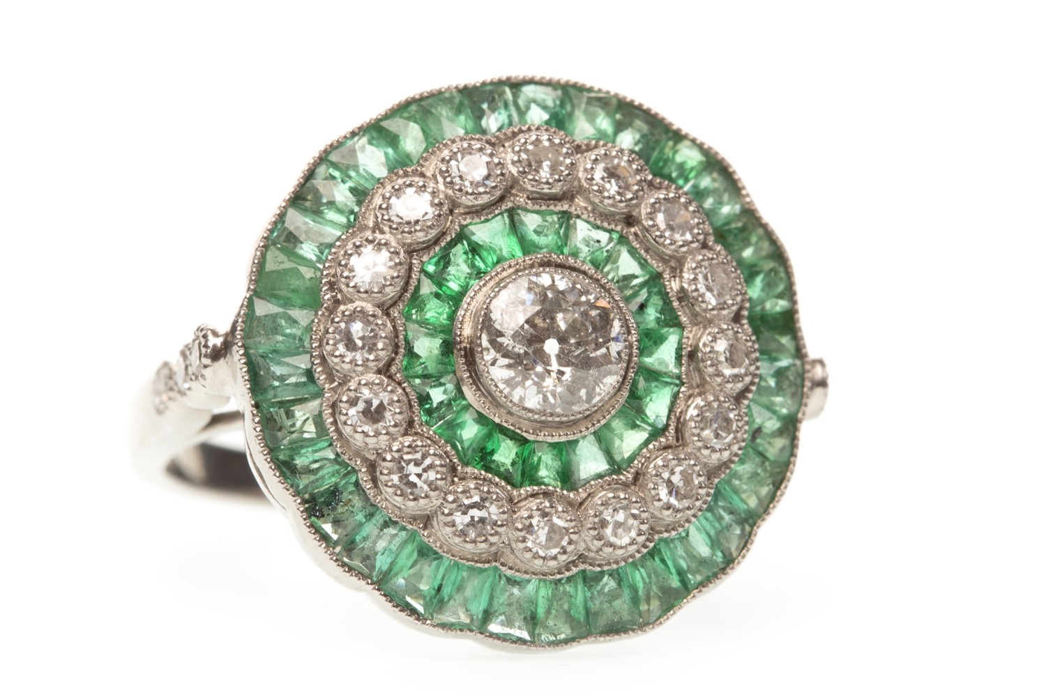 AN EMERALD AND DIAMOND TARGET RING