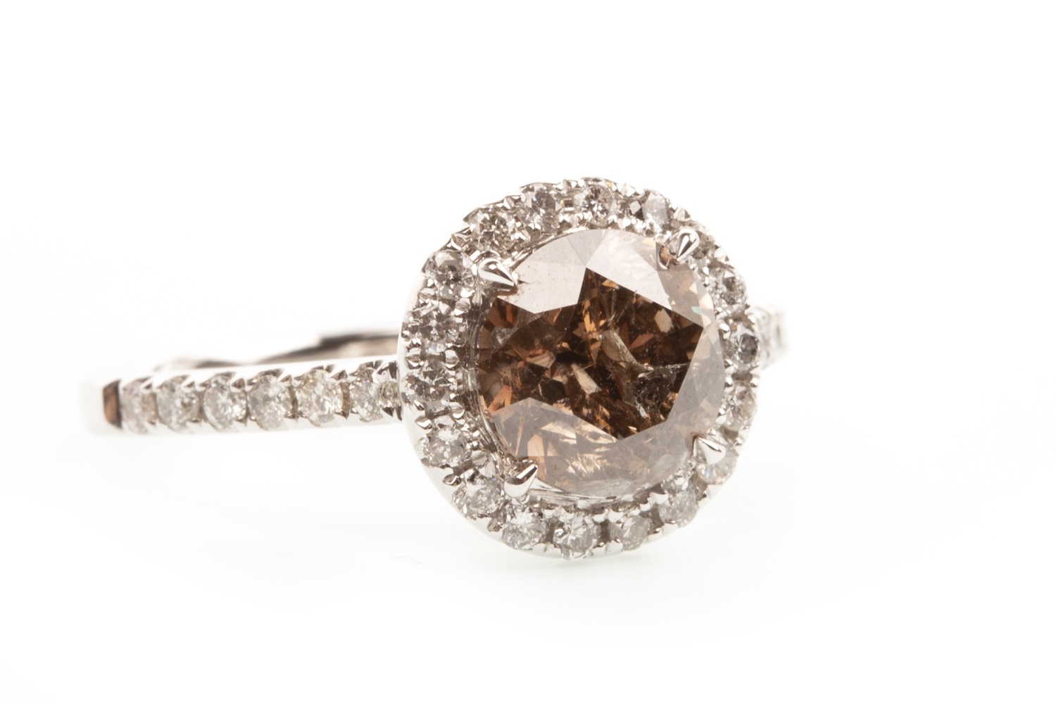 A FANCY ORANGE BROWN DIAMOND RING