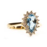 A TOPAZ AND DIAMOND RING