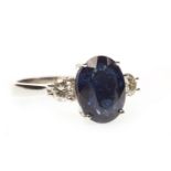 A SAPPHIRE AND DIAMOND THREE STONE RING