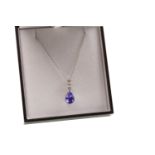 A TANZANITE AND DIAMOND PENDANT