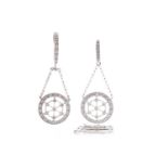 A DIAMOND PENDANT AND MATCHING EARRINGS