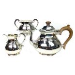 A SILVER THREE PIECE TEA SERVICE