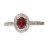 A GARNET AND DIAMOND RING