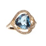 A TOPAZ AND DIAMOND RING