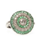 AN EMERALD AND DIAMOND TARGET RING