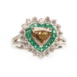 AN IMPRESSIVE HEART SHAPED DIAMOND AND EMERALD RING