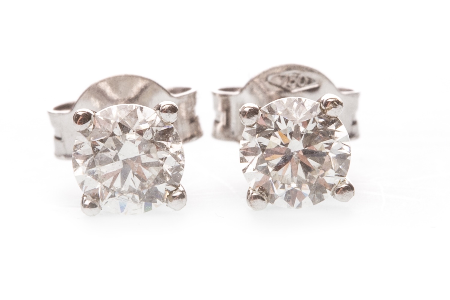 A PAIR OF DIAMOND SINGLE STONE EARRINGS