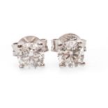 A PAIR OF DIAMOND SINGLE STONE EARRINGS