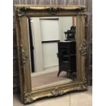 A LARGE DECORATIVE WALL MIRROR