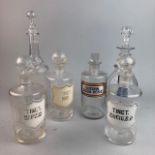 A REGENCY MALLET SHAPED DECANTER AND CHEMIST JARS