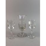 AN EARLY 20TH CENTURY GLASS GOBLET AND OTHER GLASSES