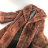 A LADY'S BROWN FUR COAT