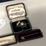 A VICTORIAN GOLD PIN AND A SILVER BROOCH