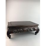 AN EARLY 20TH CENTURY CARVED CHINESE FOOTSTOOL