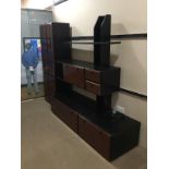 A 20TH CENTURY STAINED WOOD WALL UNIT