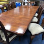 A MAHOGANY DINING TABLE AND EIGHT CHAIRS