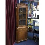 A WALNUT CORNER CUPBOARD