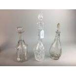 FIVE CRYSTAL DECANTERS WITH STOPPERS