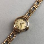 A LADIES GOLD NIVADA WRIST WATCH AND OTHER JEWELLERY